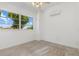 Bedroom features a bright window, AC unit and neutral carpet at 17343 Cayo Ln, Punta Gorda, FL 33955