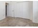 Bedroom features a wall of closets and door leading to hall at 17343 Cayo Ln, Punta Gorda, FL 33955