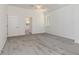 Inviting bedroom featuring soft carpet, large window, and neutral paint at 17343 Cayo Ln, Punta Gorda, FL 33955