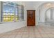 Dining area with tile floor, cabinet, and a large window offering natural light at 17343 Cayo Ln, Punta Gorda, FL 33955