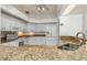 Contemporary kitchen with granite countertops, white cabinetry, recessed lighting, and updated appliances at 17343 Cayo Ln, Punta Gorda, FL 33955