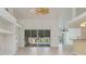Spacious living room features tile floors, fan and large sliding glass doors to pool at 17343 Cayo Ln, Punta Gorda, FL 33955