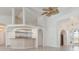 Bright, spacious living room with arched doorways and open access to the kitchen at 17343 Cayo Ln, Punta Gorda, FL 33955