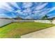 Lush green backyard with ample space, complemented by a well-maintained privacy fence at 2084 La Palma Ave, Port Charlotte, FL 33953