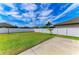Expansive backyard featuring lush green grass and a privacy fence, perfect for outdoor activities at 2084 La Palma Ave, Port Charlotte, FL 33953
