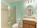 Updated bathroom with tiled shower, vanity with granite top, mirror and toilet at 2084 La Palma Ave, Port Charlotte, FL 33953
