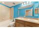 Bathroom with double sink vanity, bathtub and tiled shower at 2084 La Palma Ave, Port Charlotte, FL 33953