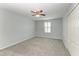 Bedroom featuring a ceiling fan, carpet and shutter-style window blinds at 2084 La Palma Ave, Port Charlotte, FL 33953