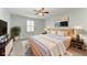 Staged bedroom with ceiling fan, coastal artwork and plantation shutters at 2084 La Palma Ave, Port Charlotte, FL 33953