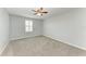 Bedroom with neutral-toned walls, ceiling fan and carpeted floor at 2084 La Palma Ave, Port Charlotte, FL 33953