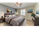 Staged bedroom with bed, rug, dresser and two night stands, plus a window with shutters at 2084 La Palma Ave, Port Charlotte, FL 33953