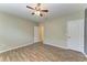 Light and airy bedroom with wood-look tile flooring, and a ceiling fan at 2084 La Palma Ave, Port Charlotte, FL 33953