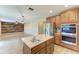 Bright kitchen featuring stainless steel appliances, granite countertops, and an island with a sink at 2084 La Palma Ave, Port Charlotte, FL 33953