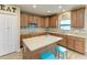 Modern kitchen featuring an island, stainless steel appliances, and tile backsplash at 2084 La Palma Ave, Port Charlotte, FL 33953