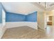 Bright living room with wood floors, wainscoting, and ample natural light at 2084 La Palma Ave, Port Charlotte, FL 33953