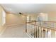 Open, bright loft space with multiple windows, railing, ceiling fan and neutral colors at 2084 La Palma Ave, Port Charlotte, FL 33953