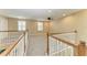 Carpeted loft space with railing, ceiling fan and multiple windows for great light at 2084 La Palma Ave, Port Charlotte, FL 33953