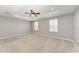 Spacious main bedroom with tray ceiling, carpet, plantation shutters and fan at 2084 La Palma Ave, Port Charlotte, FL 33953