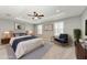 Staged main bedroom with tray ceiling, fan, plantation shutters and furniture at 2084 La Palma Ave, Port Charlotte, FL 33953