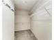 Spacious walk-in closet with built-in shelving and carpeted floor at 2084 La Palma Ave, Port Charlotte, FL 33953