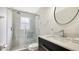 Elegant bathroom featuring a glass shower, modern vanity, and sleek fixtures at 2115 Timucua Trl, Nokomis, FL 34275