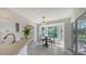Charming breakfast nook with a bay window overlooking the landscaped backyard at 2115 Timucua Trl, Nokomis, FL 34275