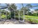 Screened lanai with tile floor and beautiful backyard views at 2115 Timucua Trl, Nokomis, FL 34275