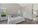 Inviting bedroom with wood flooring and large windows that provide natural light and views of the backyard at 2115 Timucua Trl, Nokomis, FL 34275
