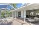 Spacious patio with a hot tub, leading to an open floor plan and beautiful backyard views at 2115 Timucua Trl, Nokomis, FL 34275