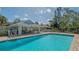 Community pool and cabana area with ample seating and clear blue water for relaxing and entertaining at 2115 Timucua Trl, Nokomis, FL 34275
