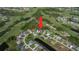 Wide aerial view of a community highlighting the property's location near a golf course at 22 Medalist Cir, Rotonda West, FL 33947