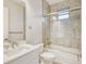 Bathroom featuring stylish marble tile, white vanity with chrome hardware, and a glass shower door at 22 Medalist Cir, Rotonda West, FL 33947