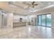 A luxury kitchen with stainless steel appliances flows to an outdoor pool through sliding glass doors at 22 Medalist Cir, Rotonda West, FL 33947