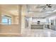 This expansive kitchen features stainless steel appliances, modern white cabinets and a large island at 22 Medalist Cir, Rotonda West, FL 33947