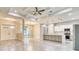 This open floor plan shows an eat-in kitchen with gray cabinets, marble countertops, and stainless appliances at 22 Medalist Cir, Rotonda West, FL 33947