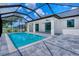 A stunning in-ground pool with a screened enclosure and a covered patio, perfect for outdoor entertaining at 22 Medalist Cir, Rotonda West, FL 33947