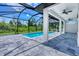 Inviting in-ground pool featuring a screened enclosure and a spacious patio for relaxation and entertainment at 22 Medalist Cir, Rotonda West, FL 33947