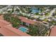 Overhead view of the community, showcasing the pool and nearby lake at 2220 Stickney Point Rd # 531, Sarasota, FL 34231
