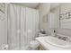 Cozy bathroom with a clean sink, toilet, shower/tub combo, and nautical themed decorations at 2220 Stickney Point Rd # 531, Sarasota, FL 34231