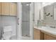 Clean and functional bathroom with a glass shower, light wood cabinets, and updated fixtures for convenience at 2220 Stickney Point Rd # 531, Sarasota, FL 34231