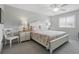 Serene bedroom with soft floral bedding, light gray walls, and natural light, promoting restful sleep at 2220 Stickney Point Rd # 531, Sarasota, FL 34231