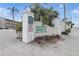 Tregate Manor Condominium entrance sign with lush landscaping in a 55+ community at 2220 Stickney Point Rd # 531, Sarasota, FL 34231