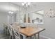 Bright dining area featuring an expansive table with seating and convenient access to the kitchen at 2220 Stickney Point Rd # 531, Sarasota, FL 34231