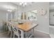 Charming dining room enhanced by natural light, ample seating, and a pass-through to the kitchen at 2220 Stickney Point Rd # 531, Sarasota, FL 34231