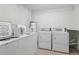 Clean laundry room equipped with modern washing machines and dryers, providing convenient laundry facilities for residents at 2220 Stickney Point Rd # 531, Sarasota, FL 34231