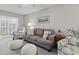 Cozy living room with plush seating, soft lighting, and balcony views, designed for comfortable living at 2220 Stickney Point Rd # 531, Sarasota, FL 34231