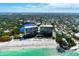 Panoramic aerial shot of beachfront condos with direct beach access and stunning ocean views at 225 Hourglass Way # 101, Sarasota, FL 34242