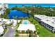 Charming community featuring a large pool, lush landscaping, and waterfront views, perfect for relaxation at 225 Hourglass Way # 101, Sarasota, FL 34242