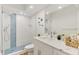 This modern bathroom features a beautiful glass shower, attractive vanity, and elegant fixtures at 225 Hourglass Way # 101, Sarasota, FL 34242