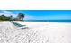 Private community beach with white sand and views of the tranquil ocean at 225 Hourglass Way # 101, Sarasota, FL 34242